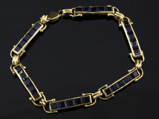 A gold and sapphire bracelet, 7.5in.